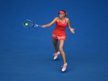 Russia's Maria Sharapova plays a shot during her women's singles match against Canada's Eugenie Bouchard on day nine of the 2015 Australian Open tennis tournament in Melbourne on January 27, 2015.