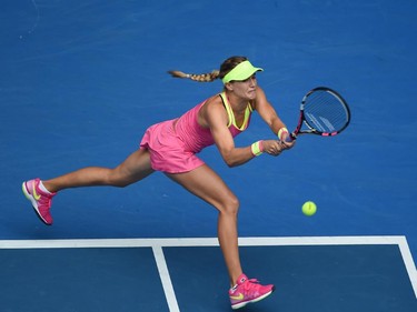 Canada's Eugenie Bouchard plays a shot during her women's singles match against Russia's Maria Sharapova on day nine of the 2015 Australian Open tennis tournament in Melbourne on January 27, 2015.