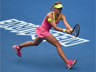 Canada's Eugenie Bouchard plays a shot during her women's singles match against Russia's Maria Sharapova on day nine of the 2015 Australian Open tennis tournament in Melbourne on January 27, 2015.