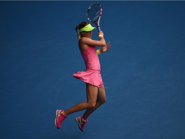 Canada's Eugenie Bouchard plays a shot during her women's singles match against Russia's Maria Sharapova on day nine of the 2015 Australian Open tennis tournament in Melbourne on January 27, 2015.