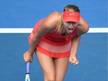 Russia's Maria Sharapova shouts during her women's singles match against Canada's Eugenie Bouchard on day nine of the 2015 Australian Open tennis tournament in Melbourne on January 27, 2015.