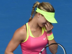 Canada's Eugenie Bouchard reacts during her women's singles match against Russia's Maria Sharapova on day nine of the 2015 Australian Open tennis tournament in Melbourne on January 27, 2015.