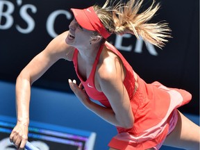Russia's Maria Sharapova serves during her women's singles semi-final match against Russia's Ekaterina Makarova on day eleven of the 2015 Australian Open tennis tournament in Melbourne on January 29, 2015.