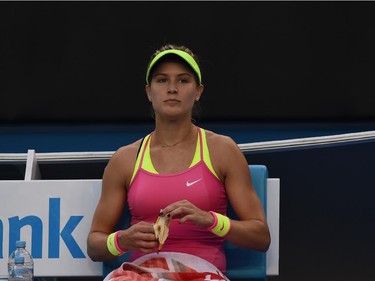 Canada's Eugenie Bouchard looks on during a break as she plays against Netherland's Kiki Bertens during their women's singles match on day three of the 2015 Australian Open tennis tournament in Melbourne on January 21, 2015.