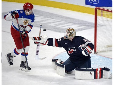 USA's goaltender Thatcher Demko makes a save on Russia's Ivan Barbashyov during the second period of quarterfinal IIHF World Junior hockey action.