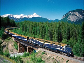 The luxury sightseeing Rocky Mountaineer train crosses Ottertail Creek in Yoho National Park in the British Columbia Rocky Mountains. T