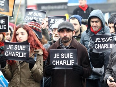 Demonstrators take part in a protest outside the Kizilay Square in Ankara on January 11, 2015 in tribute to the 12 people killed at terror attack on Charlie Hebdo offices in Paris.
