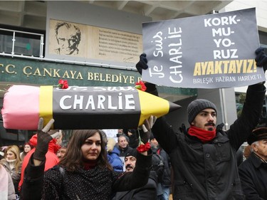Demonstrators take part in a protest outside the Kizilay Square in Ankara on January 11, 2015 in tribute to the 12 people killed at terror attack on Charlie Hebdo offices in Paris.