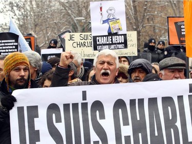 Demonstrators take part in a protest outside the Kizilay Square in Ankara on.January 11, 2015 in tribute to the 12 people killed at terror attack on Charlie Hebdo offices in Paris.