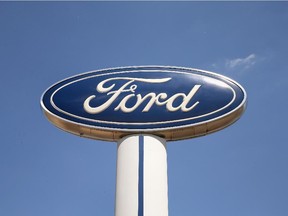 MELROSE PARK, IL - JUNE 03:  A Ford logo stands above the Al Piemonte Ford dealership on June 3, 2013 in Melrose Park, Illinois. Ford Motor Company posted a 14 percent increase in May U.S. sales compared with a year ago.