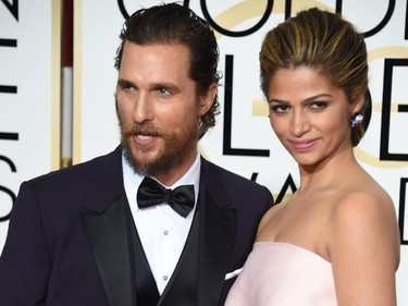 Actor Matthew McConaughey (L) and model Camila Alves arrive on the red carpet for the 72nd annual Golden Globe Awards, January 11, 2015 at the Beverly Hilton Hotel in Beverly Hills, California.