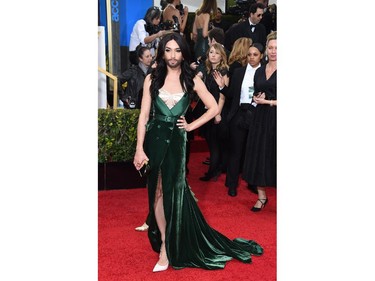 Singer Conchita Wurst  arrives on the red carpet for the 72nd annual Golden Globe Awards, January 11, 2015 at the Beverly Hilton Hotel in Beverly Hills, California.