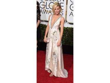 Actress Sienna Miller arrives on the red carpet for the 72nd Annual Golden Globe Awards, January 11, 2015 at the Beverly Hilton Hotel in Beverly Hills, California.