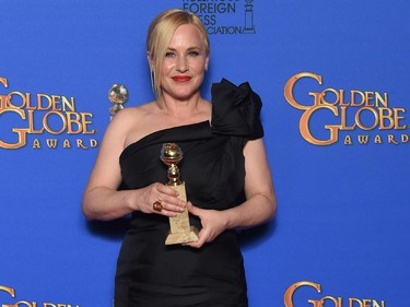 Patricia Arquette holds the award for Best Supporting Actress, Motion Picture for her role in "Boyhood", in the press room at the 72nd annual Golden Globe Awards, January 11, 2015 at the Beverly Hilton Hotel in Beverly Hills, California.