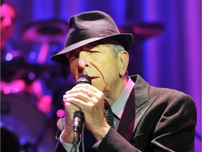 Wearing his trademark black fedora, Canadian poet and singer Leonard Cohen sings "Dance Me to the End  of Love" to open his set on the stage at Rogers Arena Monday, November 12, 2012  in Vancouver, B.C.