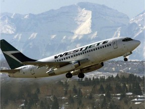 A WestJet plane takes off from the international airport in Calgary, Thursday February 13, 2003.