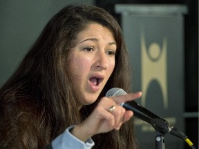 Zineb El-Rhazoui, a journalist with Charlie Hebdo, speaks to the media at a news conference, Jan. 26, 2015 in Montreal. CANADIAN PRESS/Ryan Remiorz
