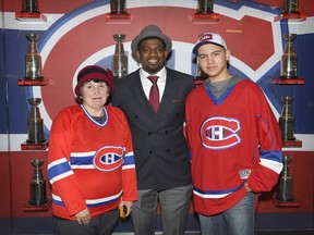 Montreal Canadiens defenceman P.K. Subban with Truro, N.S., fan Izaiah Clyke (right) and his grandmother, Karen Porter, at the Bell Centre on February 28, 2015.