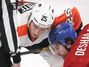 Canadiens' David Desharnais, right, and Philadelphia Flyers Ryan White watch for the linesman to drop the puck during first period of National Hockey League game in Montreal Tuesday February 10, 2015.
