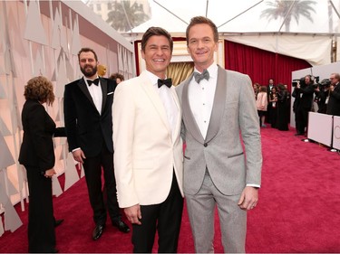 Host Neil Patrick Harris (right) and husband David Burtka attend the 87th Annual Academy Awards Feb. 22, 2015.