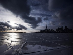 A frozen Lake Ontario is seen in front of the skyline during sub-freezing temperatures in Toronto, Jan. 7, 2014.