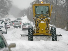 A snow plow clears de Maisonneve Blvd. in Montreal Wednesday, January 7, 2009.