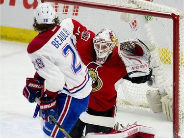 Montreal Canadiens defenceman Nathan Beaulieu screens Ottawa Senators goalie Andrew Hammond on a shot during first period NHL action Wednesday February 18, 2015 in Ottawa.