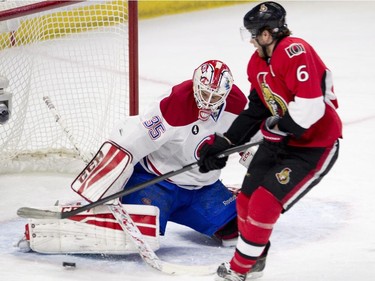 Montreal Canadiens goalie Dustin Tokarski deflects a shot from Ottawa Senators right wing Bobby Ryan during first period NHL action Wednesday February 18, 2015 in Ottawa.