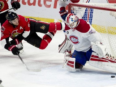Montreal Canadiens goalie Dustin Tokarski kicks out a diving shot from Ottawa Senators right wing Bobby Ryan during second period NHL action Wednesday , February 18, 2015 in Ottawa.