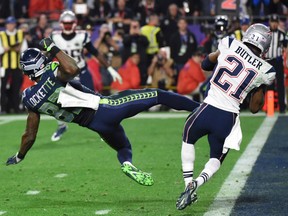 Malcolm Butler (R) of the New England Patriots intercepts a pass intended for Ricardo Lockette (L) of the Seattle Seahawks late in the fourth quarter of Super Bowl XLIX  on February 1, 2015 at University of Phoenix Stadium in Glendale, Arizona. The New England Patriots defeated the Seattle Seahawks 28-24.