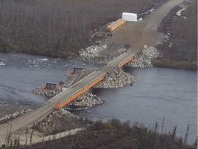 A newly constructed bridge spans the Eastmain river in northern Quebec on Thursday October 03, 2013. The bridge leads to Stornaway Diamond's Renard  mine and Camp Lagopede. They are located about 800 kms north of Montreal, on the shore of lake Kaakus Kaanipaahaapisk.