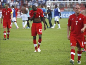 Canada's Atiba Hutchinson, centre, leaves the field after a game against Honduras during 2014 World Cup qualifying in San Pedro Sula, Honduras, on Oct. 16, 2012.