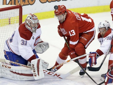 Detroit Red Wings centre Pavel Datsyuk (13), of Russia, is unable to hit the puck past Montreal Canadiens goalie Carey Price (31) during the third period of an NHL hockey game Monday, Feb. 16, 2015, in Detroit. Montreal won 2-0.