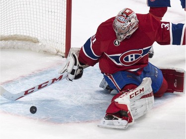 Montreal Canadiens goalie Carey Price stops a rolling puck as they face the Toronto Maple Leafs during second period NHL hockey action Saturday, February 28, 2015 in Montreal.