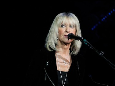 Christine McVie of the band Fleetwood Mac sings from behind an electric keyboard during the band's show at the Bell Centre in Montreal on Thursday, February 5, 2015.