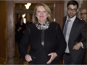 Quebec Minister of International Relations and La Francophonie Christine St-Pierre walks from a news conference Thursday, February 12, 2015 at the legislature in Quebec City.