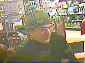 Montreal police are requesting the public's help in finding this man who allegedly threatened and robbed employees at an SAQ store.