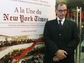 In this Nov. 21, 2011, file photo, New York Times journalist David Carr poses for a photograph as he arrives for the French premiere of the documentary "Page One: A Year Inside The New York Times," in Paris. Carr collapsed at the office and died in a hospital Thursday, Feb. 12, 2015. He was 58. Carr wrote the Media Equation column for the Times, focusing on issues of media in relation to business and culture.