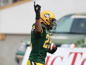 Chris Thompson celebrates after scoring touchdown for the Eskimos during game against the Alouettes at Edmonton's Commonwealth Stadium on July 11, 2010.