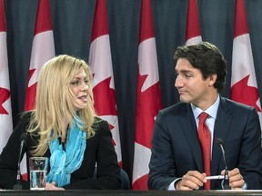 Former Conservative MP Eve Adams (left) is joined by Liberal Leader Justin Trudeau as she announces in Ottawa on Monday, Feb. 9, 2015 that she is leaving the Conservative Party to join the Liberal Party of Canada.