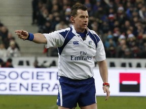 referee Nigel Owens gestures during a six nations rugby union international match between France and Scotland at the Stade de France stadium on Feb. 5, 2015.
