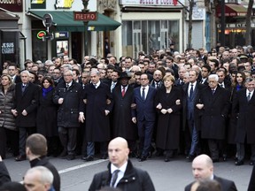 Political and national leaders march during the Unity rally "Marche Republicaine" on January 11, 2015 in Paris in tribute to the 17 victims of a three-day killing spree by homegrown Islamists. The killings began on January 7 with an assault on the Charlie Hebdo satirical magazine in Paris that saw two brothers massacre 12 people including some of the country's best-known cartoonists, the killing of a policewoman and the storming of a Jewish supermarket on the eastern fringes of the capital which killed 4 local residents.
