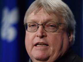 Quebec Health Minister Gaetan Barrette responds to reporters questions at a news conference, Thursday, February 12, 2015 at the legislature in Quebec City.