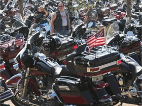 Motorcycle enthusiasts visit the Harley-Davidson Powertrain Operations plant during the company's 110th anniversary celebration on August 30, 2013 in Menomonee Falls, Wisconsin.