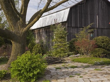In keeping with the rustic theme, the garage was constructed in the style of an old barn.