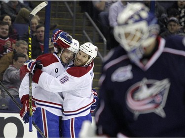Montreal Canadiens' Jacob De La Rose, left, celebrates his goal against the Columbus Blue Jackets with teammate Brandon Prust during the third period of an NHL hockey game Thursday, Feb. 26, 2015, in Columbus, Ohio. The Canadiens won 5-2.