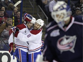 Canadiens rookie Jacob De La Rose (left) celebrates with teammate Brandon Prust after scoring goal against the Blue Jackets during game in Columbus on Feb. 26, 2015. The Canadiens won 5-2.