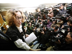 Junko Ishido, left, mother of Japanese journalist Kenji Goto, speaks during a press conference in Tokyo after the release of an online video that purported to show an Islamic State group militant beheading her son.