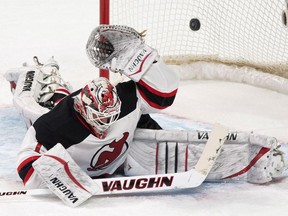 New Jersey Devils goaltender Keith Kinkaid is scored on by Montreal Canadiens' Lars Eller (not shown) during second period NHL hockey action in Montreal, Saturday, February 7, 2015.