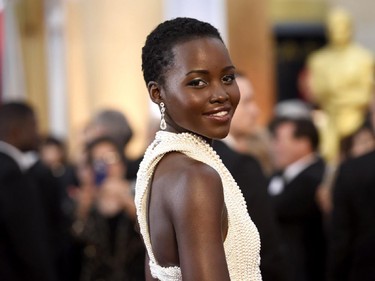 Lupita Nyong'o arrives at the Oscars on Sunday, Feb. 22, 2015, at the Dolby Theatre in Los Angeles.